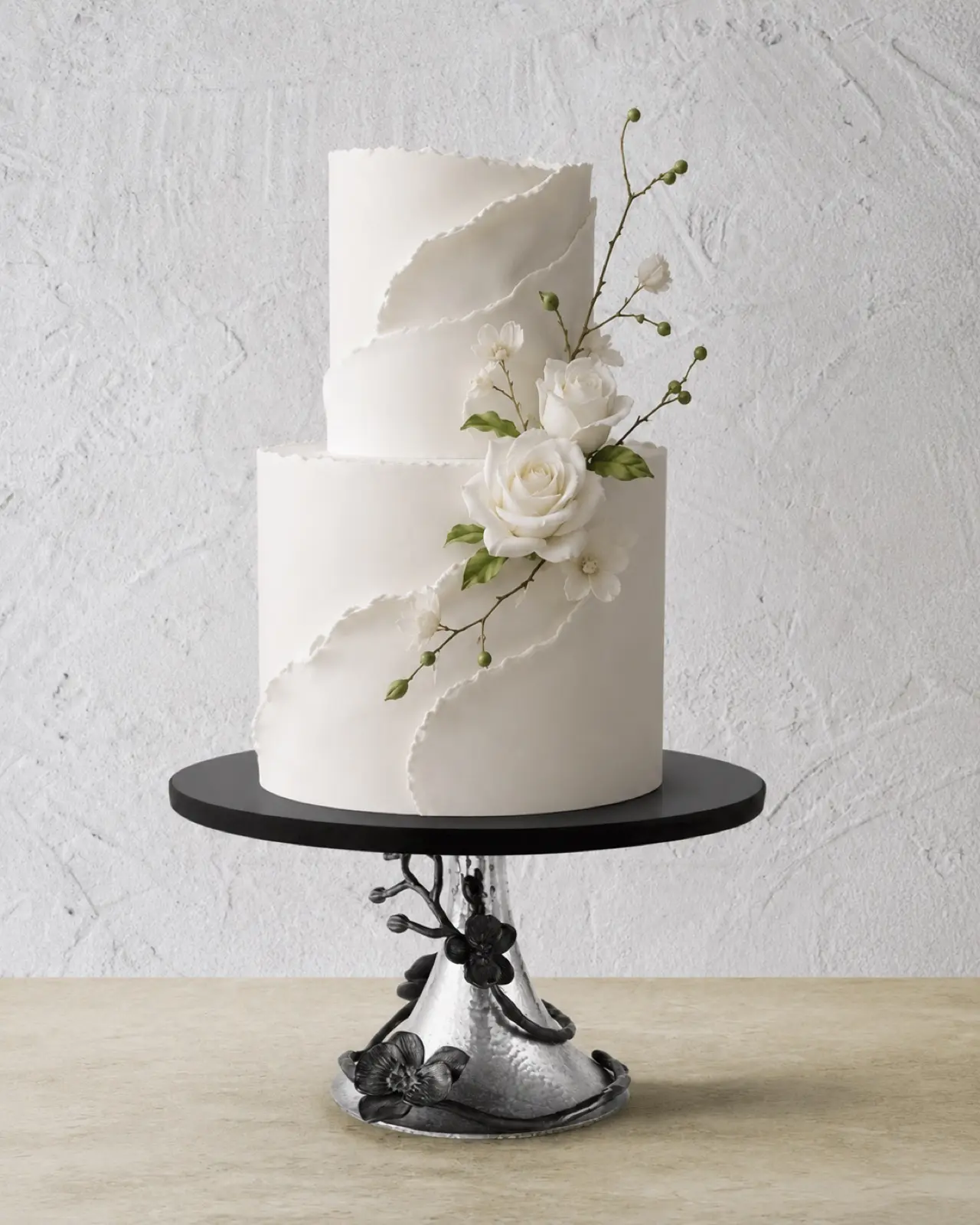 A stunning statement piece for dessert tables and cake displays. This Michael Aram Black Orchid cake stand features a black granite finish with intricate orchid detailing — elevating any cake, dessert, or centrepiece with luxury and artistry. Perfect for weddings, bridal showers, baby showers, birthdays, engagement parties, and luxury tablescapes.
