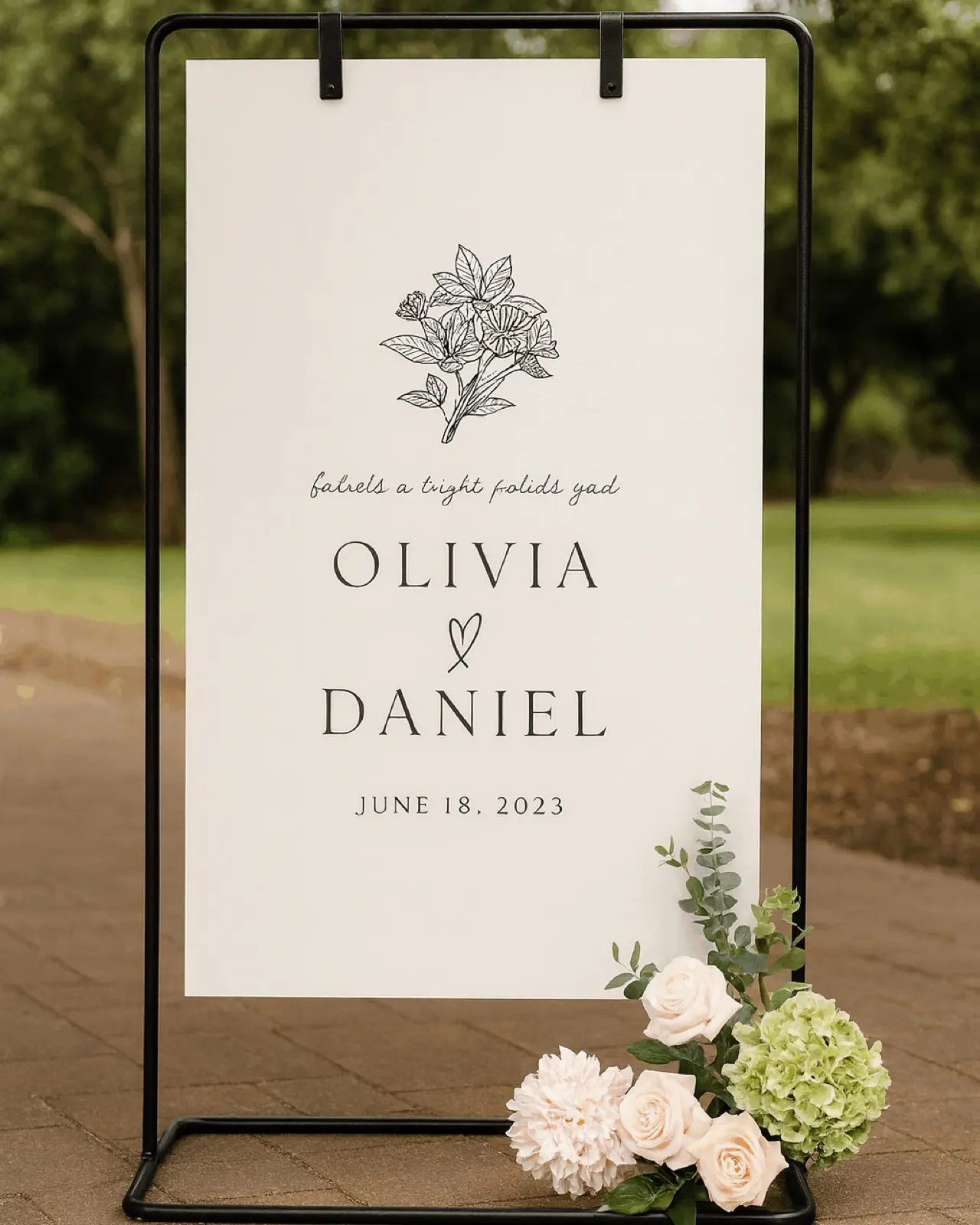 Matte black metal hanging sign stand for a modern, dramatic look. Perfect for displaying welcome signs, menus, programs, and seating charts. The black finish creates bold contrast and suits modern, industrial, and moody wedding aesthetics.
