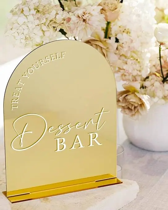 Gold-finished acrylic arch sign reading 'Dessert Bar.' Position on your dessert table or display wall to guide guests to the sweets. Matches our complete acrylic signage collection for a cohesive look.
