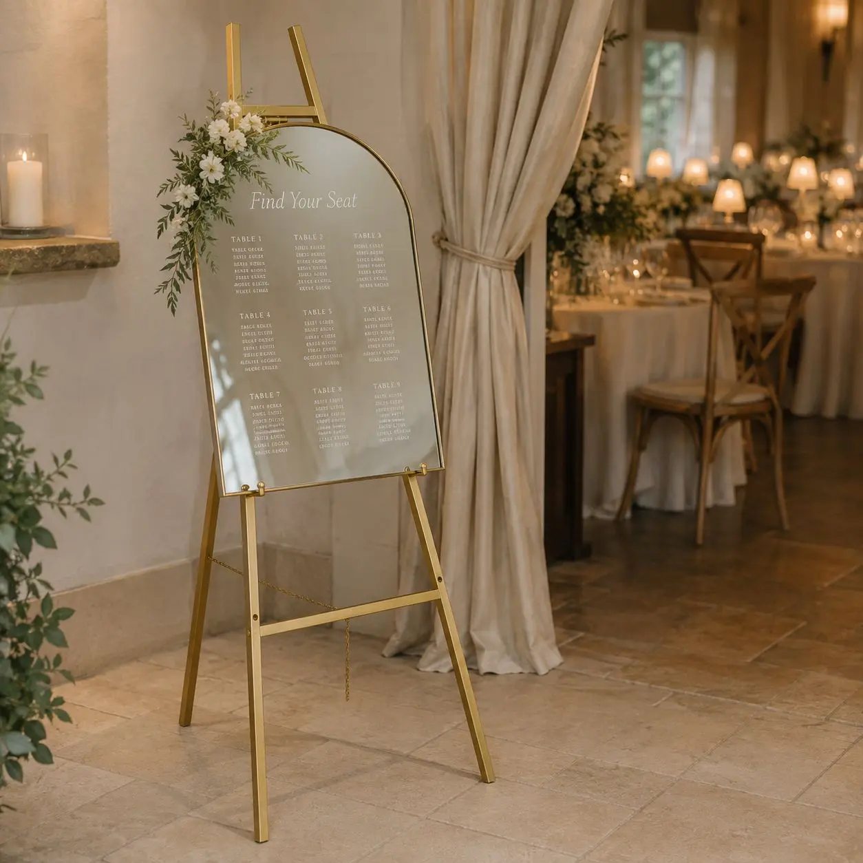 Sleek gold metal easel designed to display welcome signs, seating charts, lightweight mirrors and framed signage at weddings and special events. Features four adjustable display heights. Supports items weighing up to 25 lb.