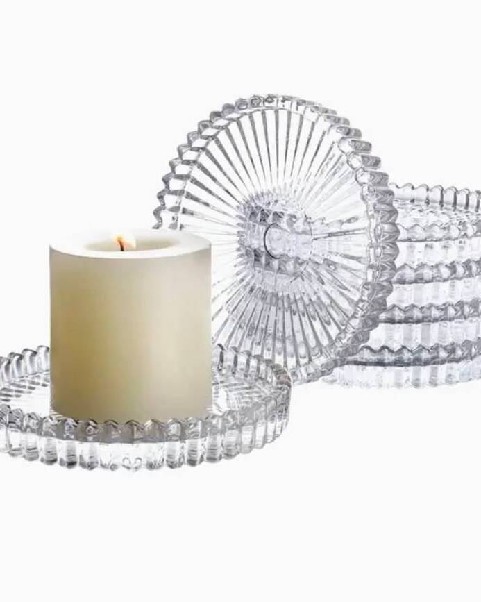 Classic clear glass pillar candle holders with a refined silhouette. Versatile enough for any wedding style, these holders create a clean, polished look that lets the candlelight take centre stage. Fits standard 3-inch pillar candles.