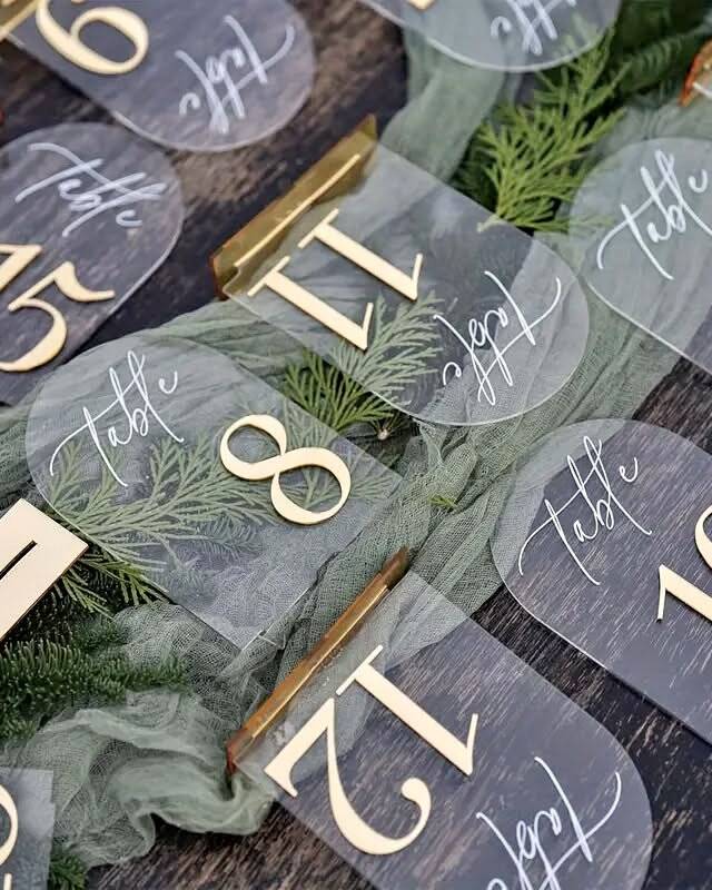 Set of 10 gold-finished acrylic arch table numbers (1 through 10). The elegant arch shape and metallic gold finish create a polished, modern look that coordinates with our other acrylic signage. Freestanding design sits securely on any table surface.