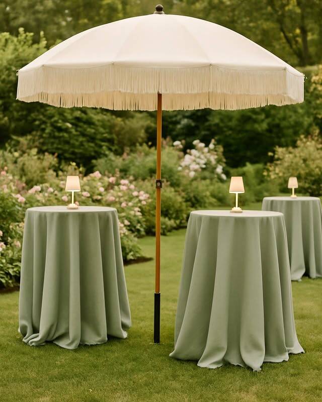 A stunning 7-foot ivory umbrella with bohemian fringe detail that makes a statement at outdoor ceremonies and cocktail hours. Comes with grass anchors for secure lawn placement. Provides shade while adding editorial, photogenic style to your outdoor event.