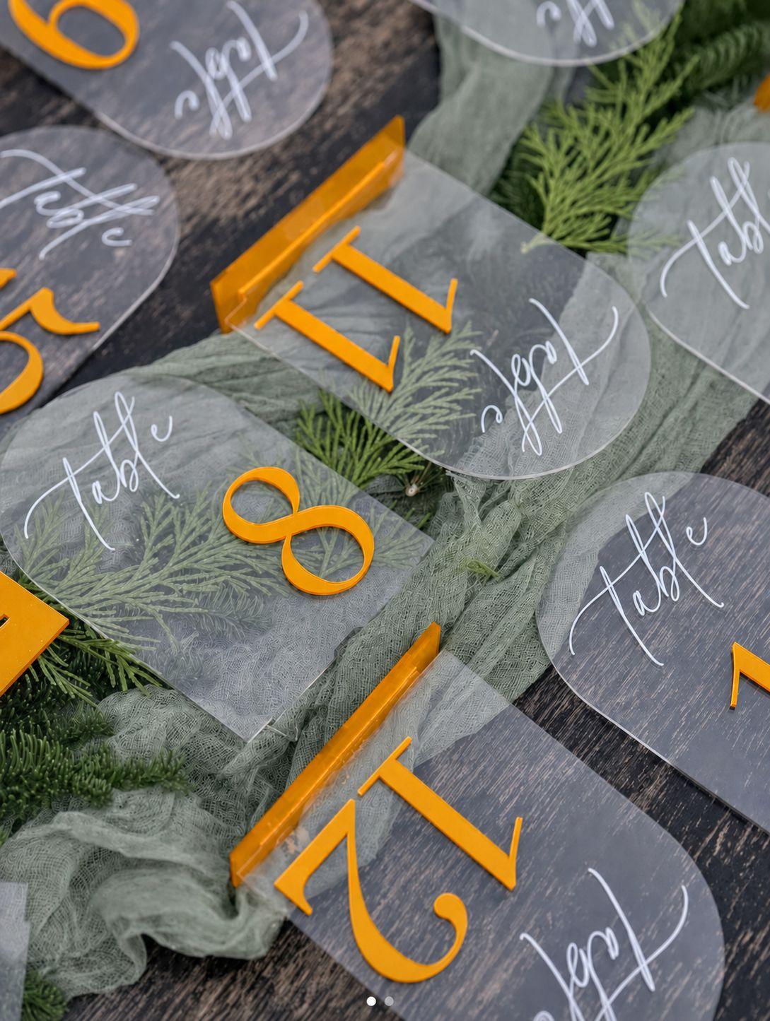Set of 10 gold acrylic arch table numbers (21 through 30) to rent for the largest celebrations. Complete the table number collection with the 1-10 and 11-20 sets for up to 30 numbered guest tables in a matching gold acrylic finish.