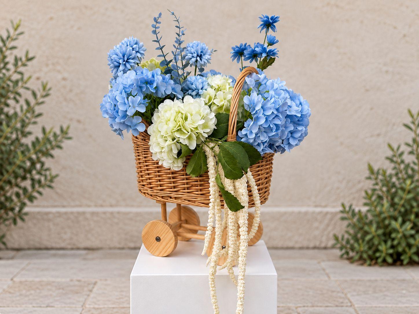 A beautiful faux floral arrangement styled in a stroller — a charming statement piece perfect for baby showers, gender reveals, and children's events. Colours can be adjusted to suit a neutral palette or soft pink to match your event theme.