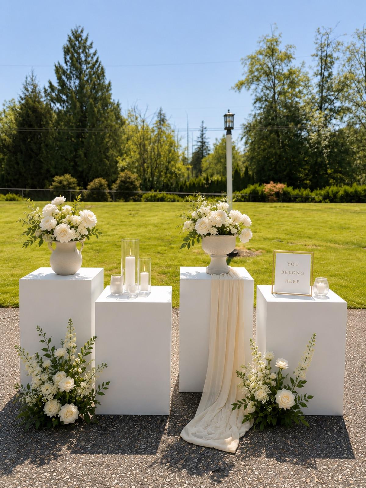 White 18-inch plinth perfect for florals, candles, signage, cakes, desserts, welcome areas, ceremony styling, product displays, and favour stations. Its clean, modern design works beautifully with any colour palette and can be styled on its own or grouped with multiple plinths to create an elevated focal point for weddings, showers, and special events.